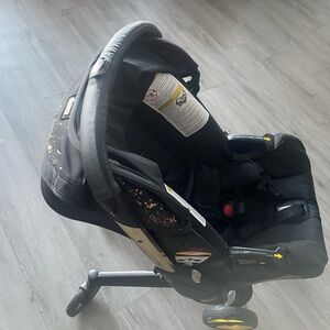 Black Infant Car Seat with Gold Accents